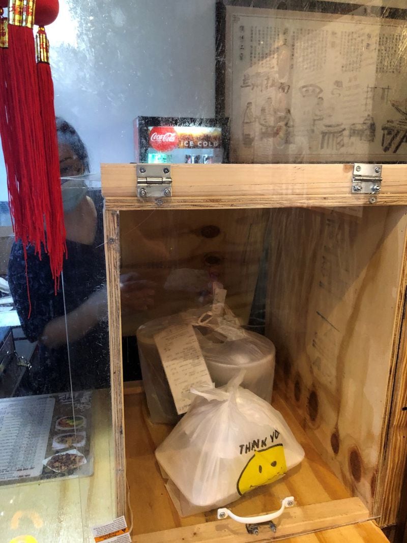 The takeout box at LanZhou Ramen has doors, inside and out, for passing food to waiting customers. CONTRIBUTED BY WENDELL BROCK