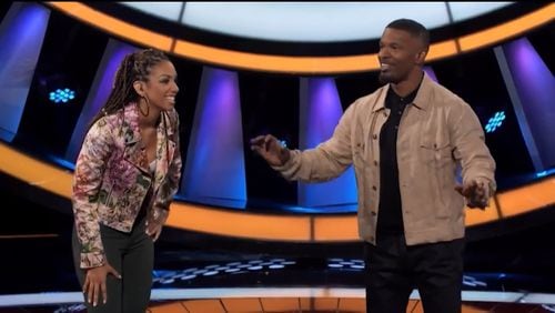 Jamie Foxx and his daughter Corinne on the show "Beat Shazam" on Fox. FOX