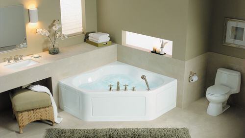 Corner install tubs can be a little larger than a standard tub, and with the finished apron-front side, you may open up even more bathroom space. (Kohler)