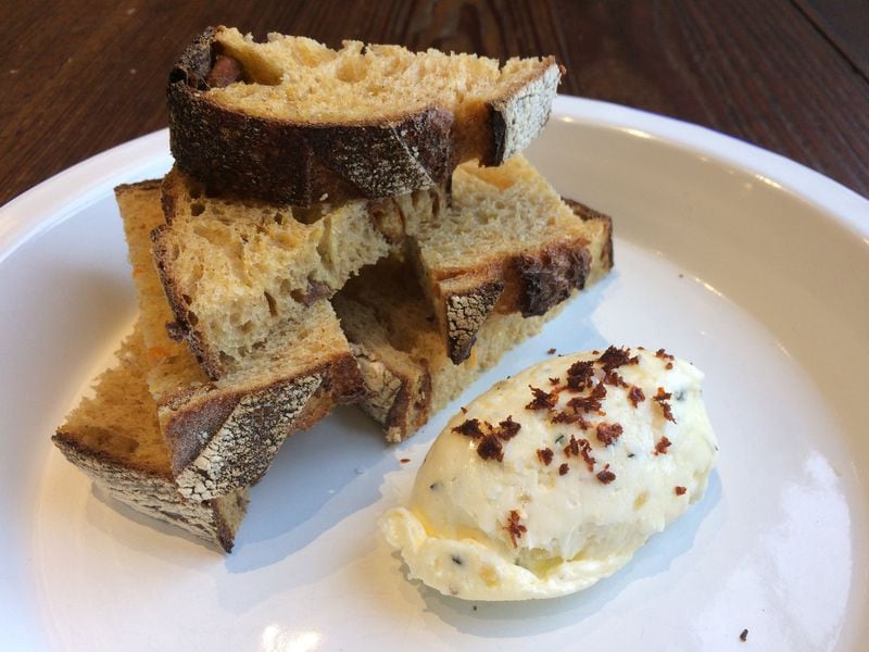 At Root Baking Co., bread and butter can be a transporting experience. The daily bread offering (here it’s a sweet-potato levain) is paired with a preserved lemon and thyme butter sprinkled with dried harissa. CONTRIBUTED BY WENDELL BROCK