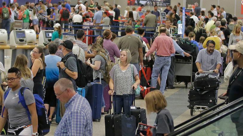 Delta passengers stand in line as the carrier slogged through day two of its recovery from a global computer outage Tuesday, Aug. 9, 2016, in Salt Lake City. Travelers on Delta Air Lines endured hundreds more canceled and delayed flights on Tuesday as the carrier slogged through day two of its recovery from a global computer outage. By early afternoon, Delta said it had canceled about 530 flights as it moved planes and crews to â€œresetâ€ its operation. Nearly 1,200 Delta flights had been delayed, according to tracking service FlightStats Inc. (AP Photo/Rick Bowmer)