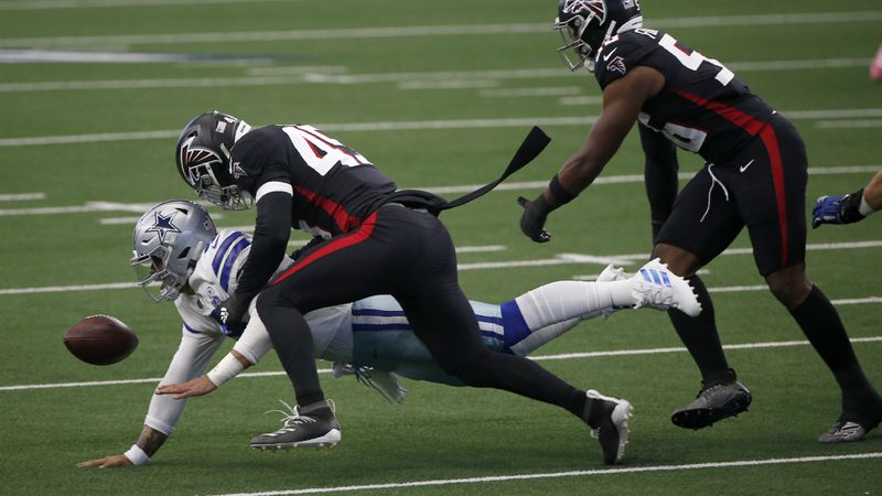 Cowboys quarterback Dak Prescott (4) fumbles the ball after being sacked by Falcons linebacker Deion Jones (45) with help from defensive end Dante Fowler Jr. (56) in the first half Sunday, Sept. 20, 2020, in Arlington, Texas. (Ron Jenkins/AP)