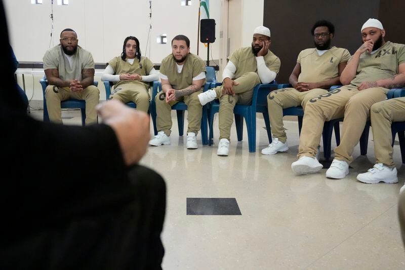 Detainees attend a book club at Department Of Corrections Division 11 in Chicago, Monday, April 22, 2024. DePaul students and detainees are currently reading Dead Man Walking and the author, anti death penalty advocate, Sister Helen Prejean attended to lead a discussion. (AP Photo/Nam Y. Huh)