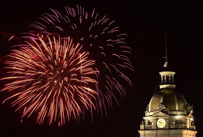 Fireworks illuminate the night sky near the Savannah City Hall dome during Thursday's 4th of July celebration in downtown Savannah.