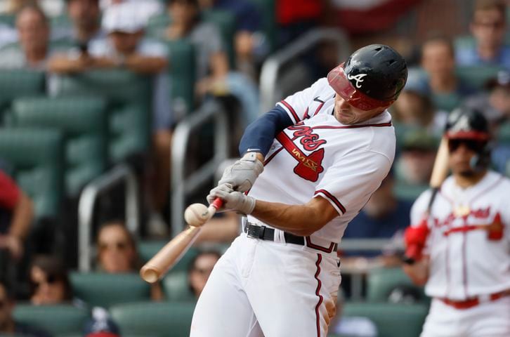 Atlanta Braves' Matt Olson singles during the third inning of game one of the baseball playoff series between the Braves and the Phillies at Truist Park in Atlanta on Tuesday, October 11, 2022. (Jason Getz / Jason.Getz@ajc.com)