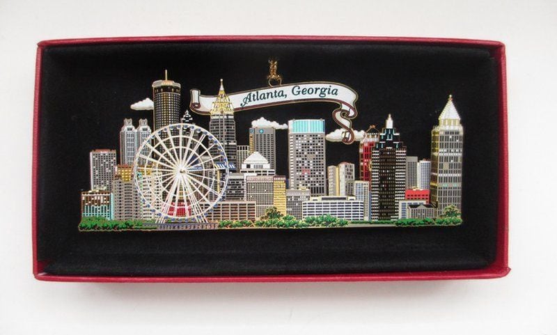 This image is from an eBay sale of a brass ornament of the Atlanta skyline, which features the SkyView Ferris wheel prominently.