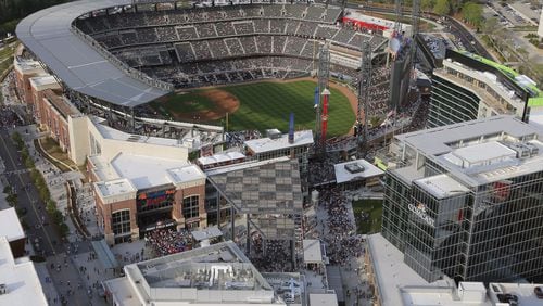 A loud alarm signal and flashing lights startled fans during the third inning of the Braves game at SunTrust Park Tuesday night, just a day after an attack by a suicide bomber at a pop concert in Manchester, England, left at least 22 dead. AJC file photo