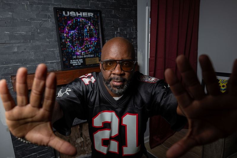 Clark Atlanta alumni Marshall Thomas, known as DJ Mars, poses for a photograph showing the plaque he obtained for the last residency show he performed with Usher in Las Vegas. DJ Mars has been Usher’s collaborator for over three decades.
Miguel Martinez /miguel.martinezjimenez@ajc.com