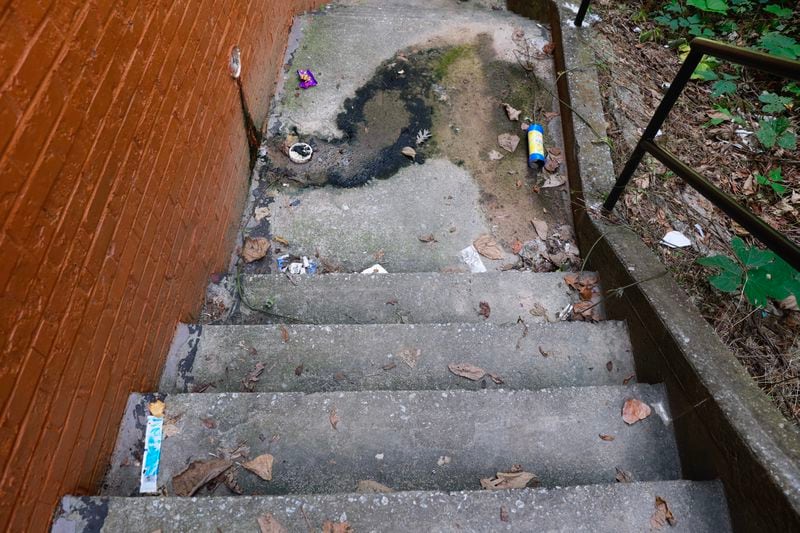Steps at Woodland Heights were covered with trash and mold during a visit in July of this year. A new federal inquiry asks the U.S. Department of Housing and Urban Development whether it follows its own regulations to force federally subsidized, private landlords to make repairs on properties that fail physical inspections. (Natrice Miller/natrice.miller@ajc.com)