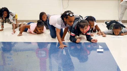 Third graders race  "puff mobiles" as part of a science project in Atlanta Public Schools' 2018 summer school program at Peyton Forest Elementary School.   Bob Andres / bandres@ajc.com