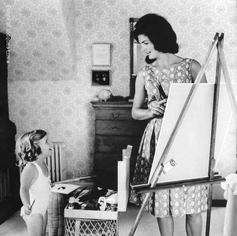 “Creating Camelot: The Kennedy Photography of Jacques Lowe” features intimate photos of the Kennedy family, including this image of Jacqueline and daughter Caroline painting, taken by their official photographer Jacques Lowe.