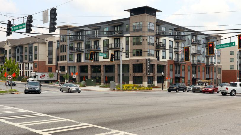 Norcross is in the midst of redeveloping its stretch of Buford Highway. The Brunswick, a large apartment complex, opened in late 2020 at the highway's intersection with Holcomb Bridge Road as part of the city's first steps to revitalize the area. (Tyler Wilkins / tyler.wilkins@ajc.com)