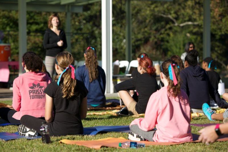 Campers enjoy a relaxing yoga session led by Roswell Yoga Life instructor Jaimee Schick. The session was part of the Prissy Tomboy Adventure Challenge Camp Day held recently at Georgia Tech. Prissy Tomboy is a lifestyle brand that promotes athleticism and a place for girls to feel empowered, recognized, and supported through sports.