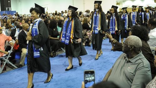 Erica Lamberson leads a group of woman entering the Spelman College commencement ceremony, Sunday, May 17, 2015, at the Georgia International Convention Center in Atlanta. Spelman ranked 6th among the 50 best colleges for African Americans, in a new ranking from Essence and MONEY magazines.(Special/John Amis)