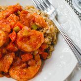 A healthy and hearty bowl of Shrimp Creole in spiced tomato gravy over brown rice. (Styling by Cynthia Graubart / Virginia Willis for the AJC)