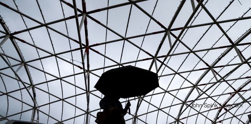 Trip Wilhoit walks under the unfinished canopy at Hartsfield-Jackson International Airport's North Terminal on Wednesday morning. JOHN SPINK / JSPINK@AJC.COM