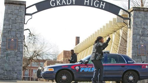 February 27, 2013 Atlanta: Police investigate on the 10th Street side of the school parking lot. A 17-year-old female student at Grady High School suffered a self-inflicted gunshot wound to the leg Wednesday morning, Feb. 27, 2013 in what police called an accidental shooting.