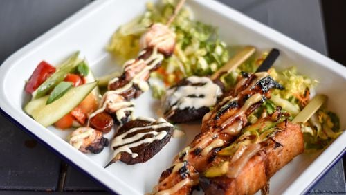 A selection of yakitori at Whiskey Bird, including (from left to right) charred octopus, shiitake mushroom, sticky soy chicken and pork belly. CONTRIBUTED BY HENRI HOLLIS