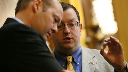 March 26, 2015 - Atlanta - Senator Joshua McKoon (right), sponsor of SB 129, the religious liberty bill, confers with Rep. Barry Fleming, R - Harlem, after he used his point of privilege during this morning's senate session to promote his bill, saying that in spite of the threatened loss of millions of dollars in convention business, having the protections are worth it. Fleming is a member of the House Judiciary committee considering the bill. BOB ANDRES / BANDRES@AJC.COM State Sen. Josh McKoon (right), with Rep. Barry Fleming, R-Harlem. AJC file/Bob Andres, bandres@ajc.com
