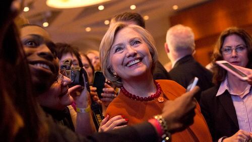 Democratic presidential candidate Hillary Clinton poses for a photo with members of the audience during the Founders Day Gala, Saturday, April 2, 2016, in Milwaukee. (AP Photo/Mary Altaffer)