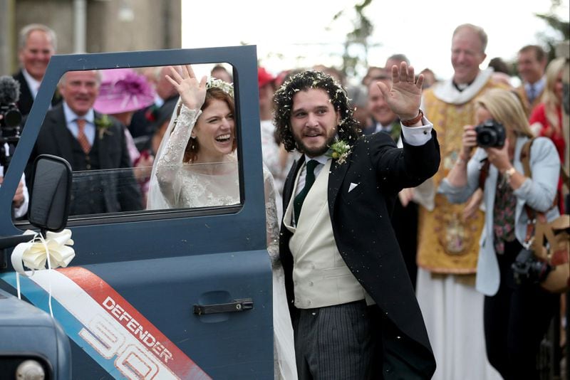Actors Kit Harington and Rose Leslie reacts as they leave after their wedding ceremony, at Rayne Church, Kirkton of Rayne in Aberdeenshire, Scotland, Saturday June 23, 2018.