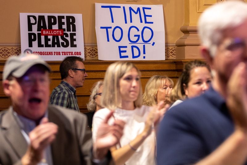 A sign aimed at Ed Lindsey was seen at the State Election Board meeting in Atlanta earlier this month.