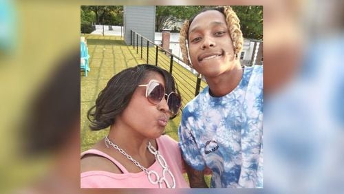 Mariolyn Dennis is seen taking a selfie with her son Keelon Tate, who was killed in a shooting in November.