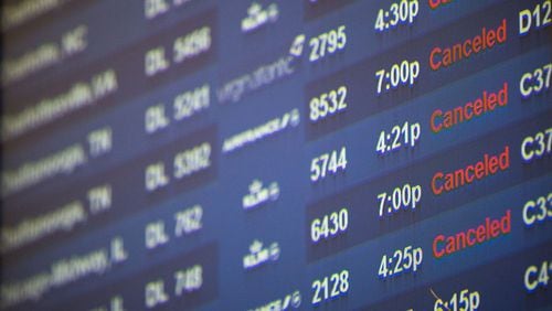 In this file photo, monitors show several canceled Delta flights at Hartsfield-Jackson Atlanta International Airport, Friday, Jan. 6, 2017, in Atlanta. Delta canceled about 350 flights due to inclement weather.  BRANDEN CAMP/SPECIAL