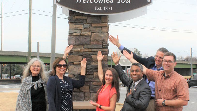 Left to right: Councilman Pam Fleming, Mayor Donna Pittman, Councilman Shannon Hillard, Councilman Md Naser, City Manager Shawn Gillen and Councilman Robert Patrick pose next to the main city entrance sign.