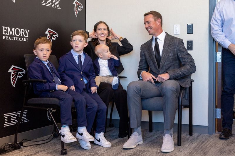 Former Falcons quarterback Matt Ryan with his family before his retirement press conference in Flowery Branch.
