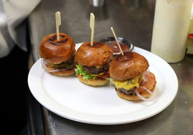 Sliders prepared at Public House restaurant, 400 North State Street in Chicago, are nearly ready for transport to the nearby Kinzie Hotel on Wednesday, Aug. 2, 2017. Guests at the Kinzie can order room service meals from Public House.  (Terrence Antonio James/Chicago Tribune/TNS)