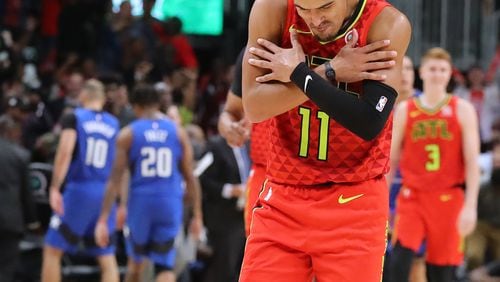 October 26, 2019 Atlanta: Atlanta Hawks guard Trae Yound reacts to hitting a three pointer in the final minutes for a 103-99 victory over the Orlando Magic in the home opener in a NBA basketball game on Saturday, October 26, 2019, in Atlanta. Young scored 39 points in the game.   Curtis Compton/ccompton@ajc.com