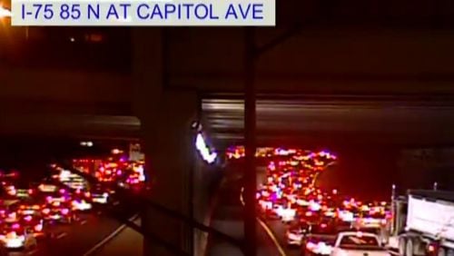 An injury crash blocked lanes and slowed traffic on the Downtown Connector Monday at Capitol Avenue. (Credit: Channel 2 Action News)