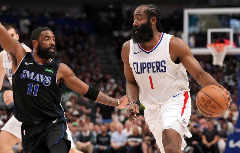 Los Angeles Clippers guard James Harden (1) drives against Dallas Mavericks guard Kyrie Irving (11) during the first half of Game 6 of an NBA basketball first-round playoff series Friday, May 3, 2024, in Dallas. (AP Photo/Jeffrey McWhorter)