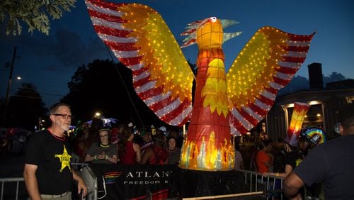 Volunteer, Greg Martin, looks out for one of the large lanterns before the start of the Atlanta BeltLine Lantern Parade in 2018. This year’s parade happens Sept. 21, in conjunction with the Old Fourth Ward Fall Fest. STEVE SCHAEFER / SPECIAL TO THE AJC