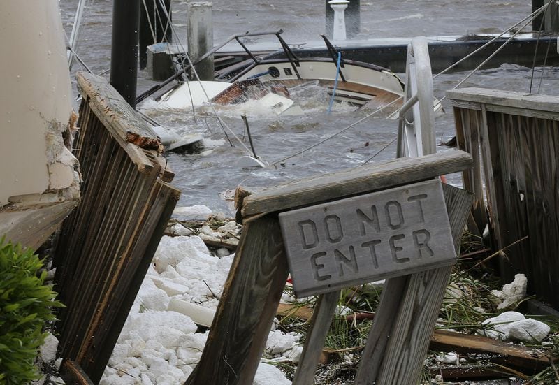 St. Marys: A dock comes to quick end and a destroyed cabin boat sits on the bottom after Hurricane Irma swept through the Town on Monday in St. Marys. (Curtis Compton/ccompton@ajc.com)