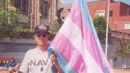 Cobb County resident Monica Helms in 2001 with the original trans pride flag she created.
Courtesy of Monica Helms