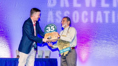Colorado Governor John Hickenlooper honored Great American Beer Festival founder Charlie Papazian at the 35th anniversary awards ceremony. PHOTO CREDIT: © 2016 Jason E. Kaplan