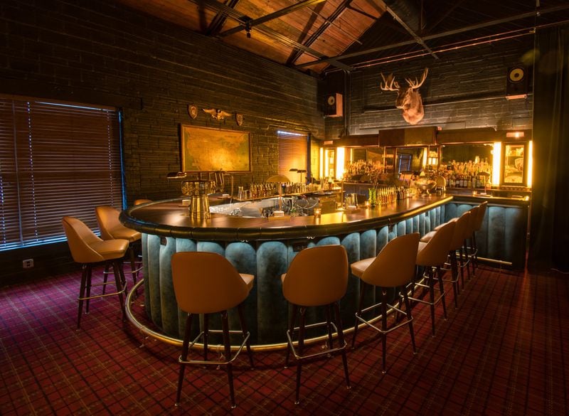 The horseshoe-shaped bar at Golden Eagle is bathed in warm light, creating an immersive experience. CONTRIBUTED BY HENRI HOLLIS