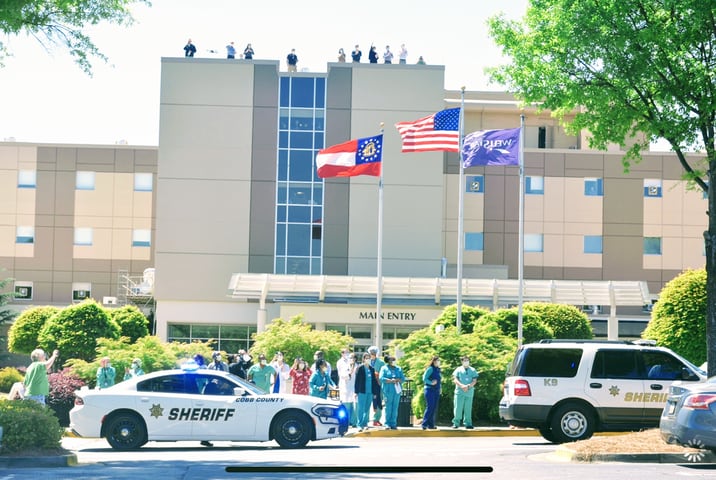 Cobb sheriff’s deputies form parade to honor frontline healthcare workers