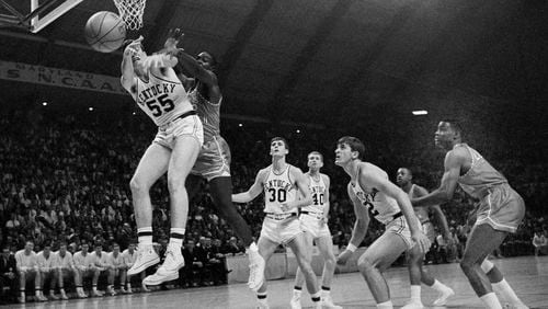 In this March 19, 1966, file photo, Kentucky’s Thad Jaracz (55) and Texas Western’s David Lattn (42) reach for a rebound during the first half of the NCAA men’s baksetball championship game in College Park, Md. Kentucky’s Pat Riley is in the foreground. Other Kentucky players shown are Tommy Kron (30) and Larry Conley (40). (AP Photo/File)