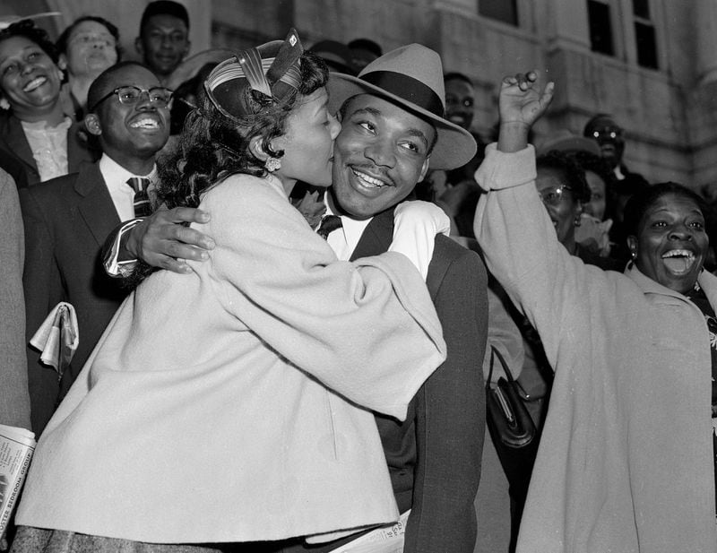 FILE - In this March 22, 1956, file photo, the Rev. Martin Luther King Jr. is welcomed with a kiss by his wife, Coretta, after leaving court in Montgomery, Ala. (AP Photo/Gene Herrick, File)