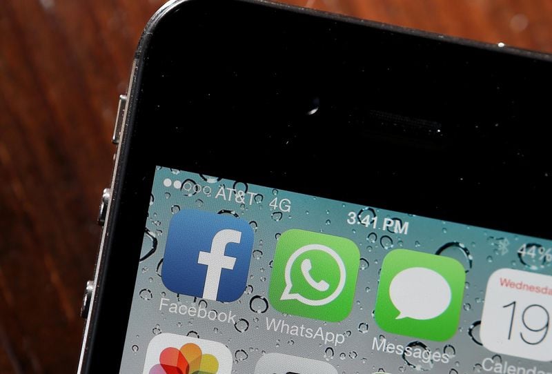 FILE PHOTO: The Facebook and WhatsApp app icons are displayed on an iPhone.