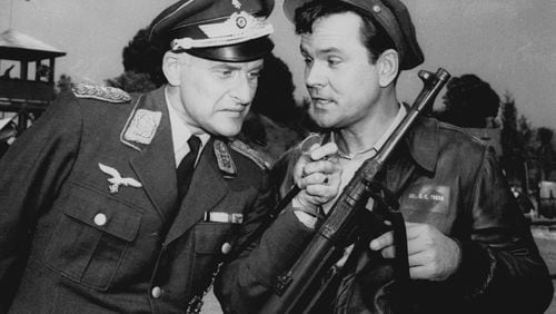 In the classic TV series “Hogan’s Heroes” — which starred Robert Crane (right) as Col. Hogan and Werner Klemperer (left) as Col. Klink — the German guards were clueless to the shenanigans of POWs during World War II. (Associated Press / undated AP file photo)