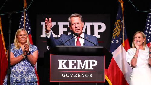 052422 Atlanta: Governor Brian Kemp delivers his election night party speech with First Lady Marty Kemp and his daughter Jarrett standing on stage at the College Football Hall of Fame on Tuesday, May 24, 2022, in Atlanta.    “Curtis Compton / Curtis.Compton@ajc.com”