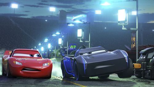 Lightning McQueen, voiced by Owen Wilson, left, and Armie Hammer voiced by Jackson Storm duke it out in “Cars 3.” Contributed by Disney-Pixar via AP