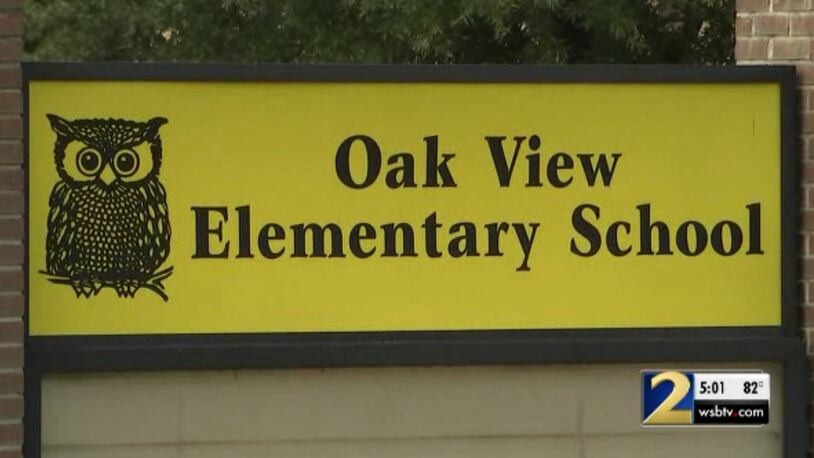 Two young girls allegedly had their hands tied behind their backs by two teachers at Oak View Elementary School.