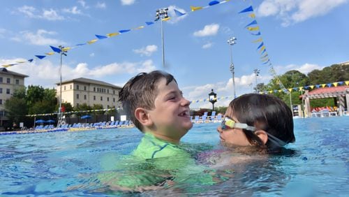 Robert Frierson, 7, and his sister Sarah Frierson, 8, play at The Aquatics Center at Emory University’s Student Activity & Academic Center in summer 2016. HYOSUB SHIN / HSHIN@AJC.COM