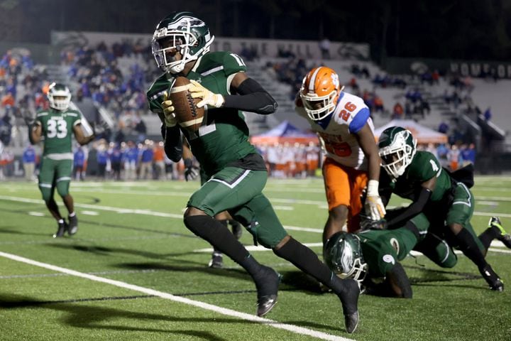 Dec. 11, 2020 - Suwanee, Ga: Collins Hill defensive back Travis Hunter (12) returns an interception for a touchdown in the first half against Parkview during the Class AAAAAAA quarterfinals game at Collins Hill high school Friday, December 11, 2020 in Suwanee, Ga.. JASON GETZ FOR THE ATLANTA JOURNAL-CONSTITUTION