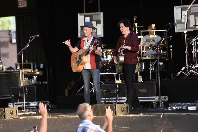 Patrick Simmons, left, and John McFee greet the crowd at the Doobie Brothers concert on Saturday, July 9, 2022, at the Pavilion at Star Lake in Burgettstown, Pennsylvania. (Maya Giron/Pittsburgh Post-Gazette via AP)